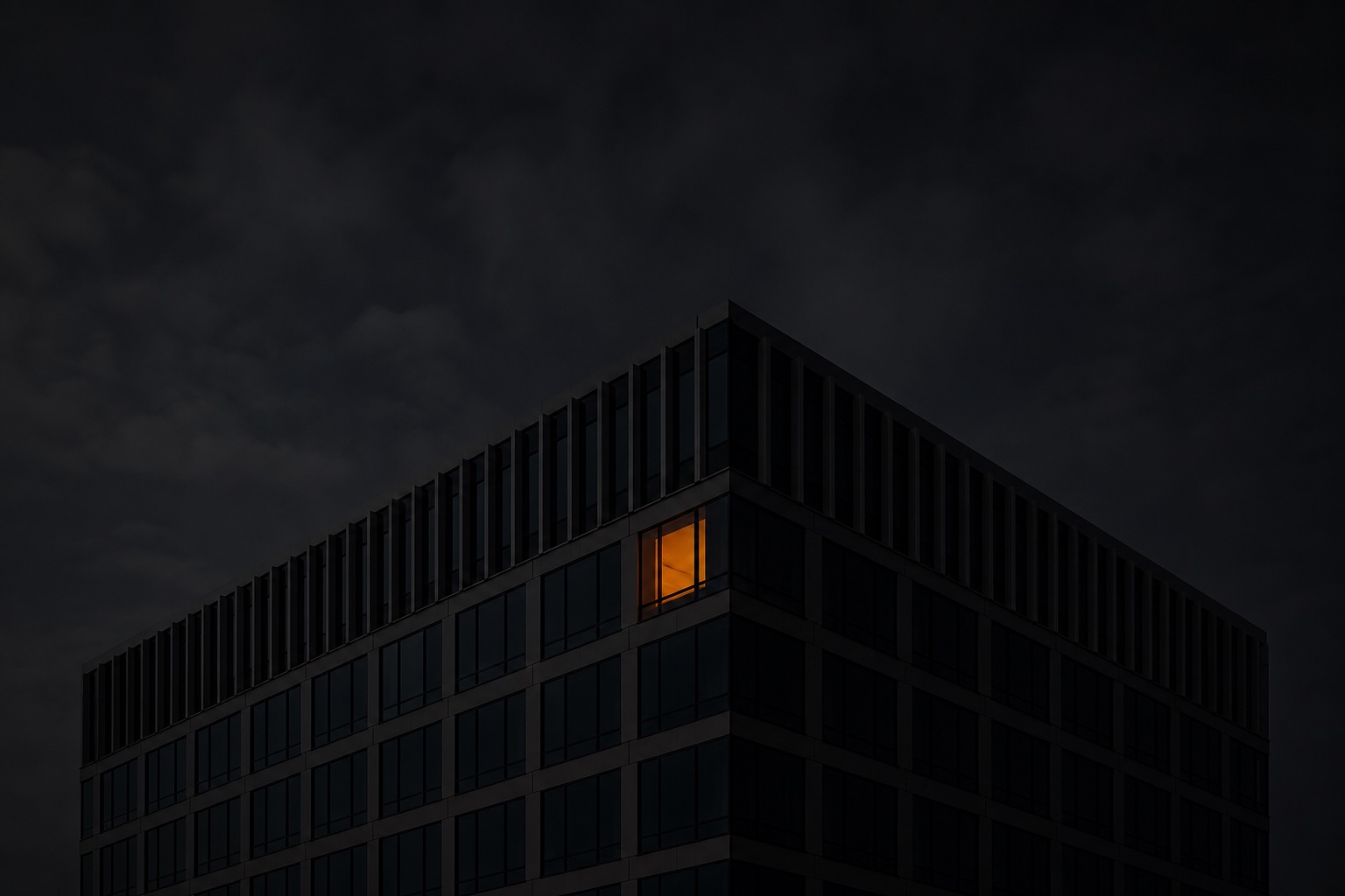 A building at night, one window lit — data kept safe inside